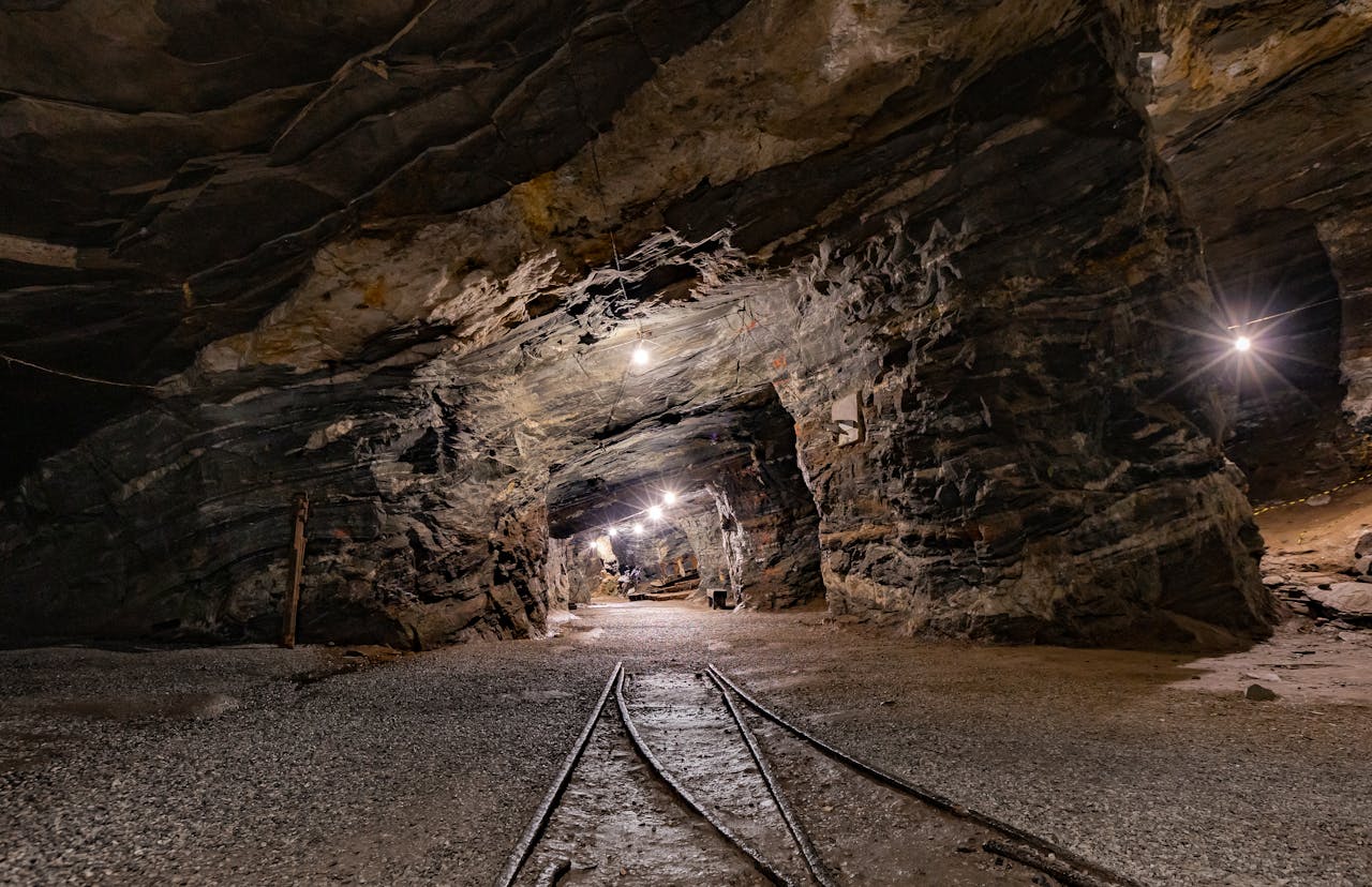 Explore the mysterious depths of Passagem de Mariana, MG, Brazil, with this illuminated underground mine tunnel.